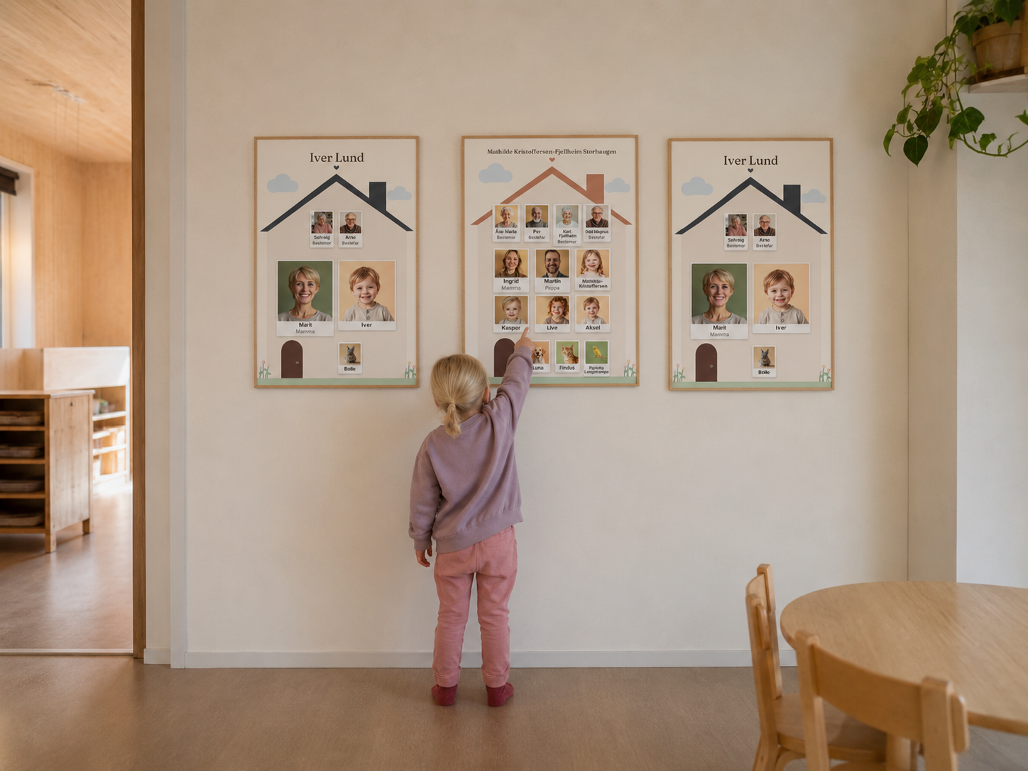 Et barn som peker på familiehusene på veggen